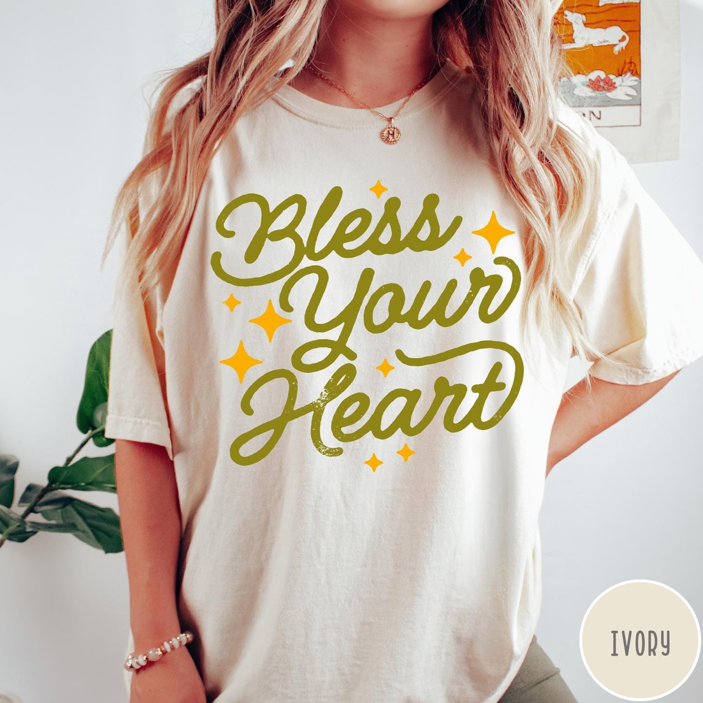 Comfort Colors tee in Ivory featuring script lettering and star accents with the phrase Bless Your Heart