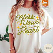 Comfort Colors tee in Ivory featuring script lettering and star accents with the phrase Bless Your Heart