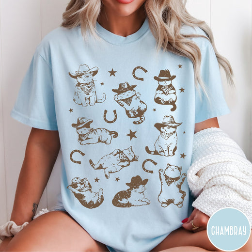 Comfort Colors tee in Chambray featuring western graphic style with multiple cowboy kittens and horseshoe illustrations