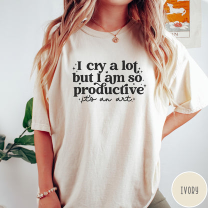 Comfort Colors tee in Ivory featuring mental health humor graphic text I Cry but Productive