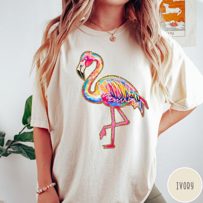 Comfort Colors tee in Ivory featuring artistic watercolor flamingo graphic with gold glitter outline details