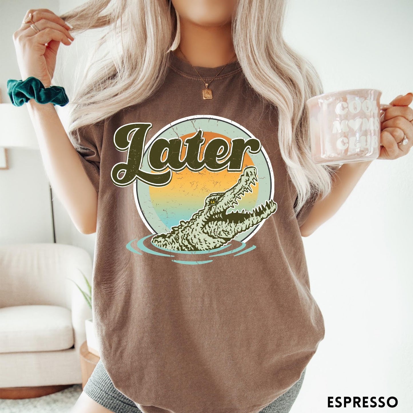 Comfort Colors tee in Espresso featuring vintage style graphic of an alligator emerging from water with sunset background