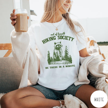 Comfort Colors tee in White featuring outdoor style graphic of a raccoon standing in the forest