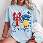 Comfort Colors tee in Chambray featuring lobster boil graphic with a lobster, cooking pot, and lemon slices.