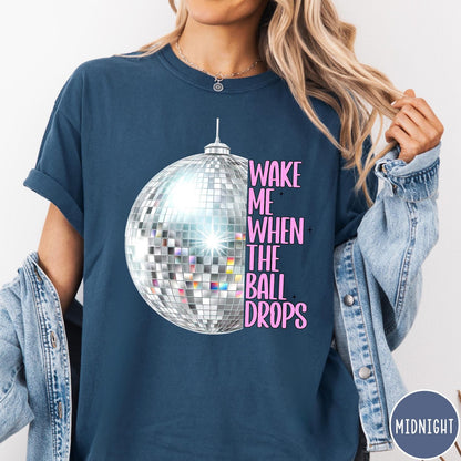 Comfort Colors tee in Midnight featuring disco ball graphic with text Wake Me When The Ball Drops