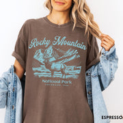 Comfort Colors tee in Espresso featuring vintage style graphic of an elk standing in front of mountains