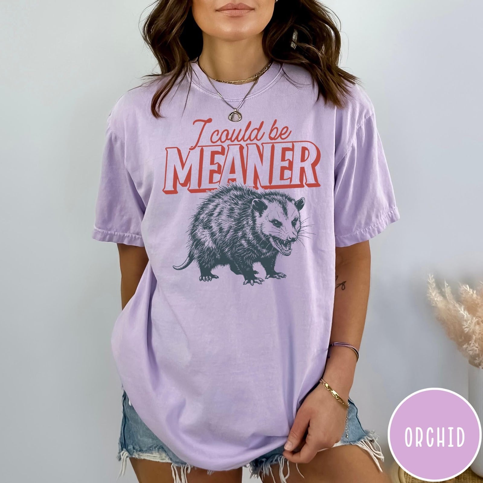 Comfort Colors tee in Orchid featuring screen printed opossum graphic with text I could be meaner