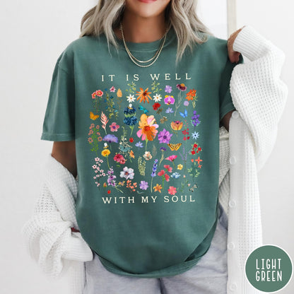 Comfort Colors tee in Light Green featuring wildflower bouquet graphic and It Is Well With My Soul text