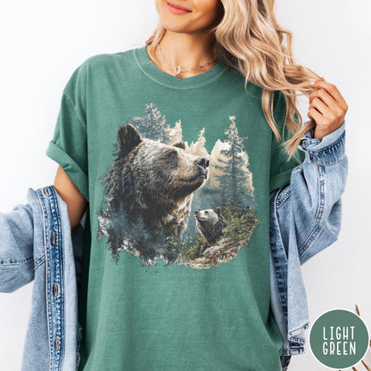 Comfort Colors tee in Light Green featuring vintage nature graphic with two bears in a forest