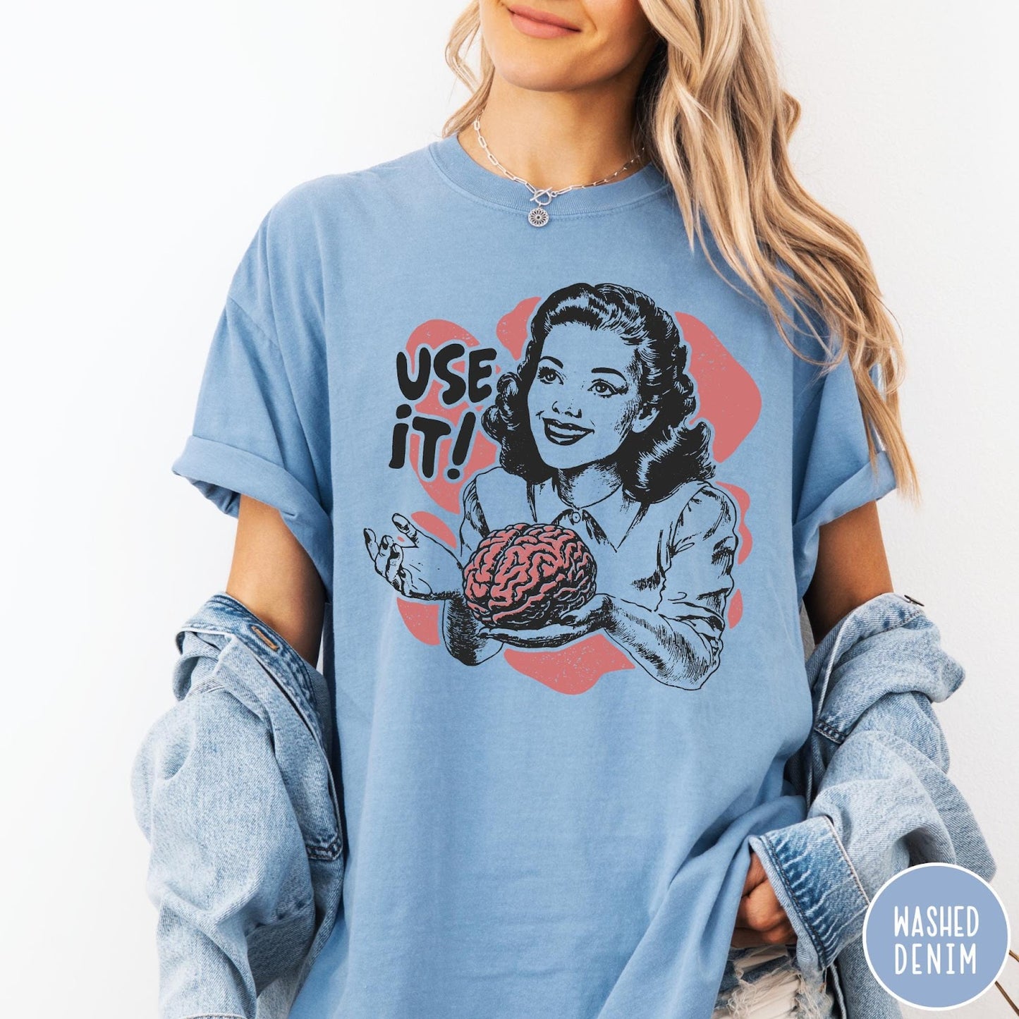 Comfort Colors tee in Washed Denim featuring retro design of a woman holding a brain with text Use It