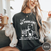 Comfort Colors tee in Pepper featuring graphic design of a bear pushing a shopping cart with treats