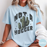 Comfort Colors tee in Chambray featuring cactus graphic and Not a Hugger text with small stars