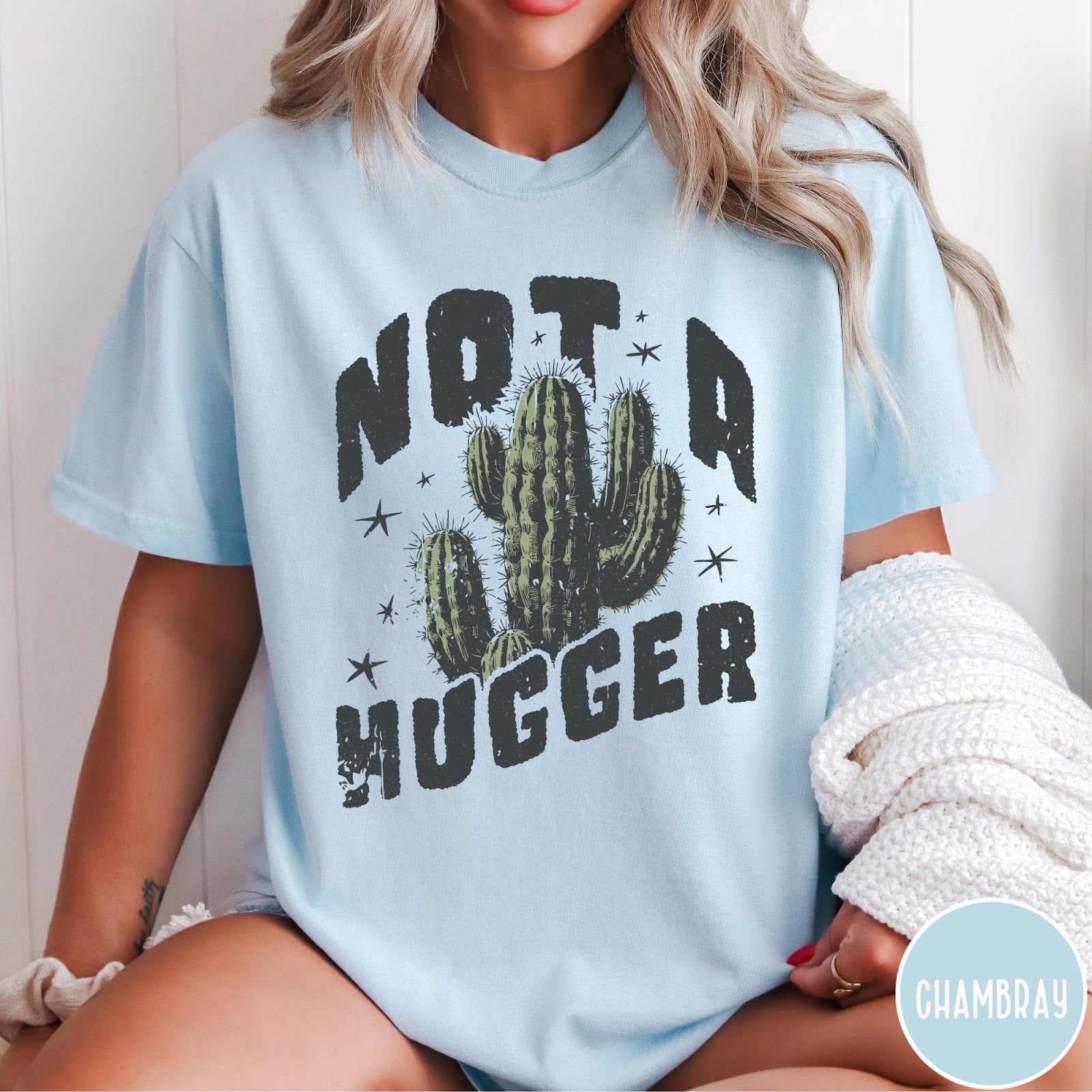 Comfort Colors tee in Chambray featuring cactus graphic and Not a Hugger text with small stars