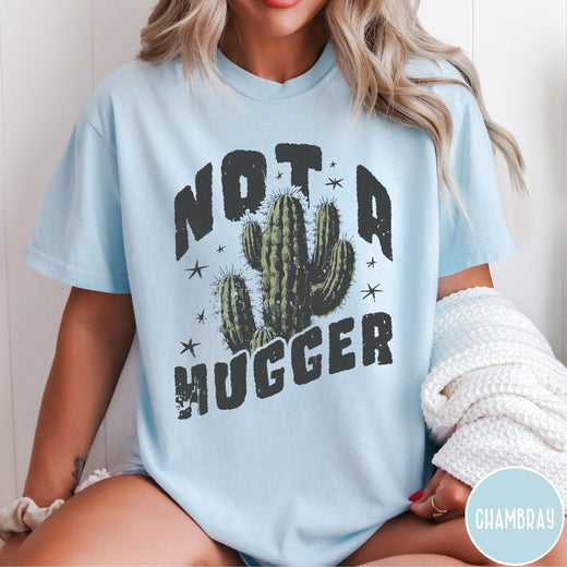 Comfort Colors tee in Chambray featuring cactus graphic and Not a Hugger text with small stars