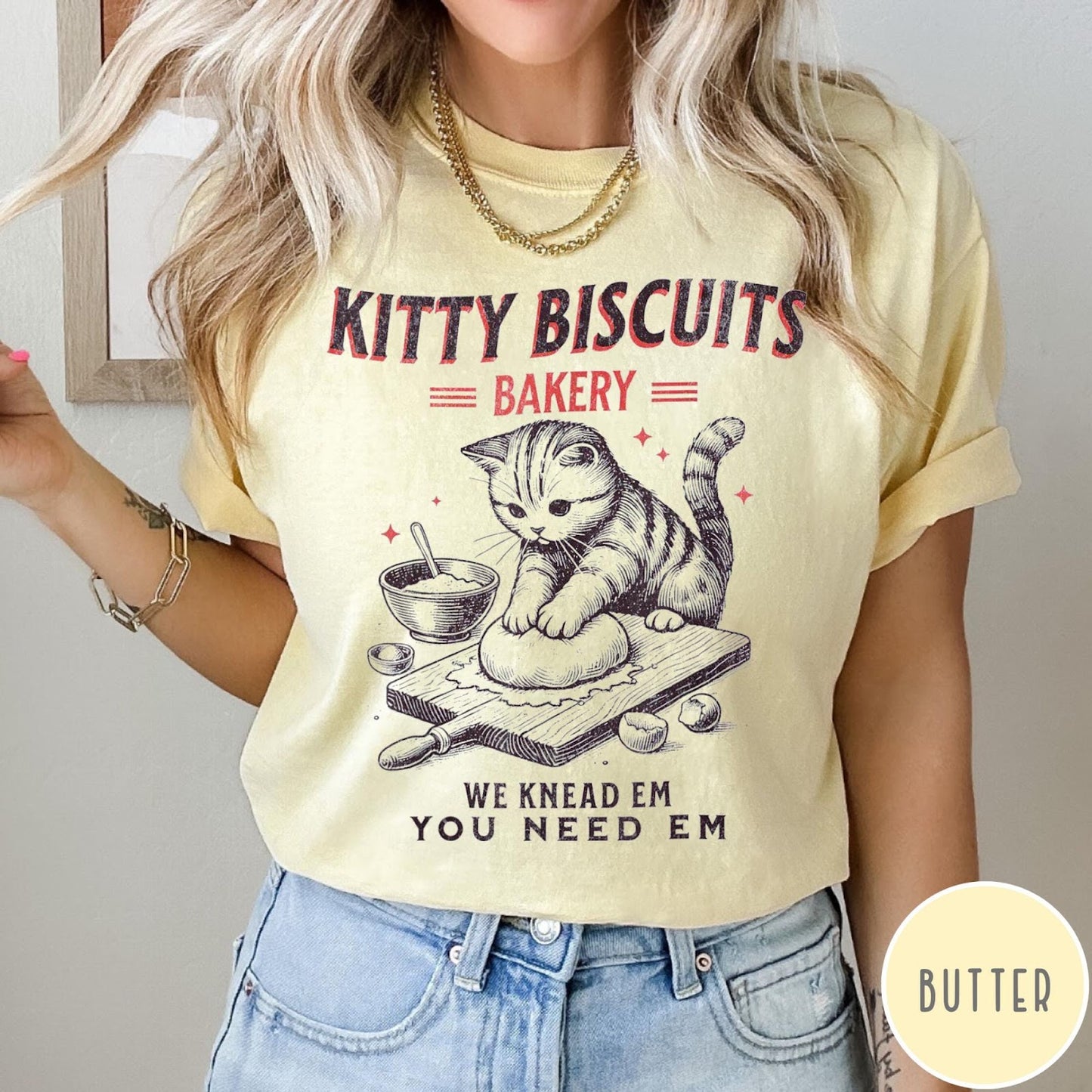 Comfort Colors tee in Butter featuring vintage style graphic of a cute cat kneading dough for biscuits