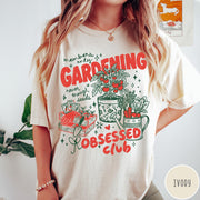 Comfort Colors tee in Ivory featuring retro graphic gardening design with tomato plant, seeds, and gardening tools