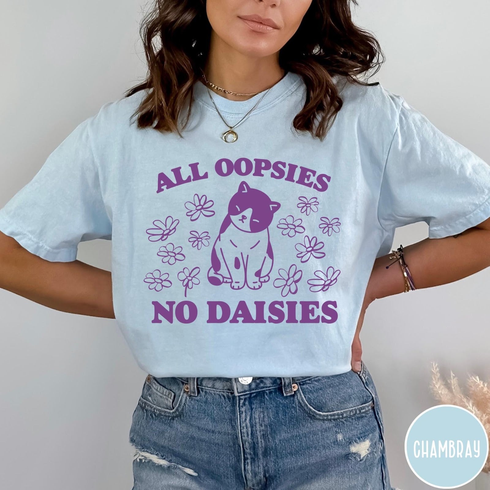 Comfort Colors tee in Chambray featuring cat graphic with purple text reading All Oopsies No Daisies