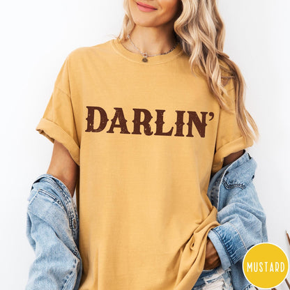 Comfort Colors tee in Mustard featuring western typography with the word Darlin' in a distressed brown font