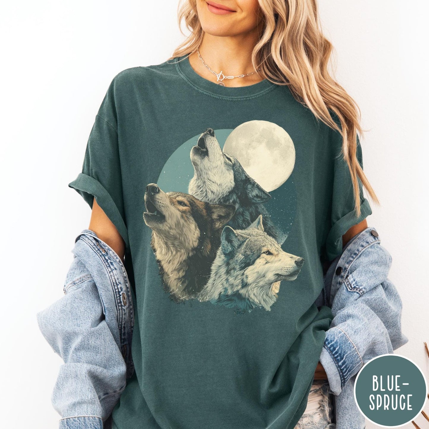 Comfort Colors tee in Blue Spruce featuring vintage style graphic of three howling wolves under a full moon
