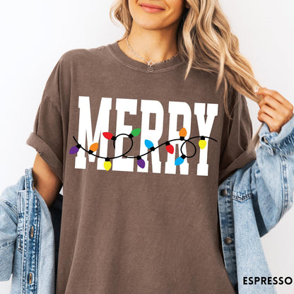 Comfort Colors tee in Espresso featuring holiday style graphic with white Merry text and colorful Christmas lights
