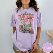 Comfort Colors tee in Orchid featuring vintage style pin-up woman sitting on a steam train graphic