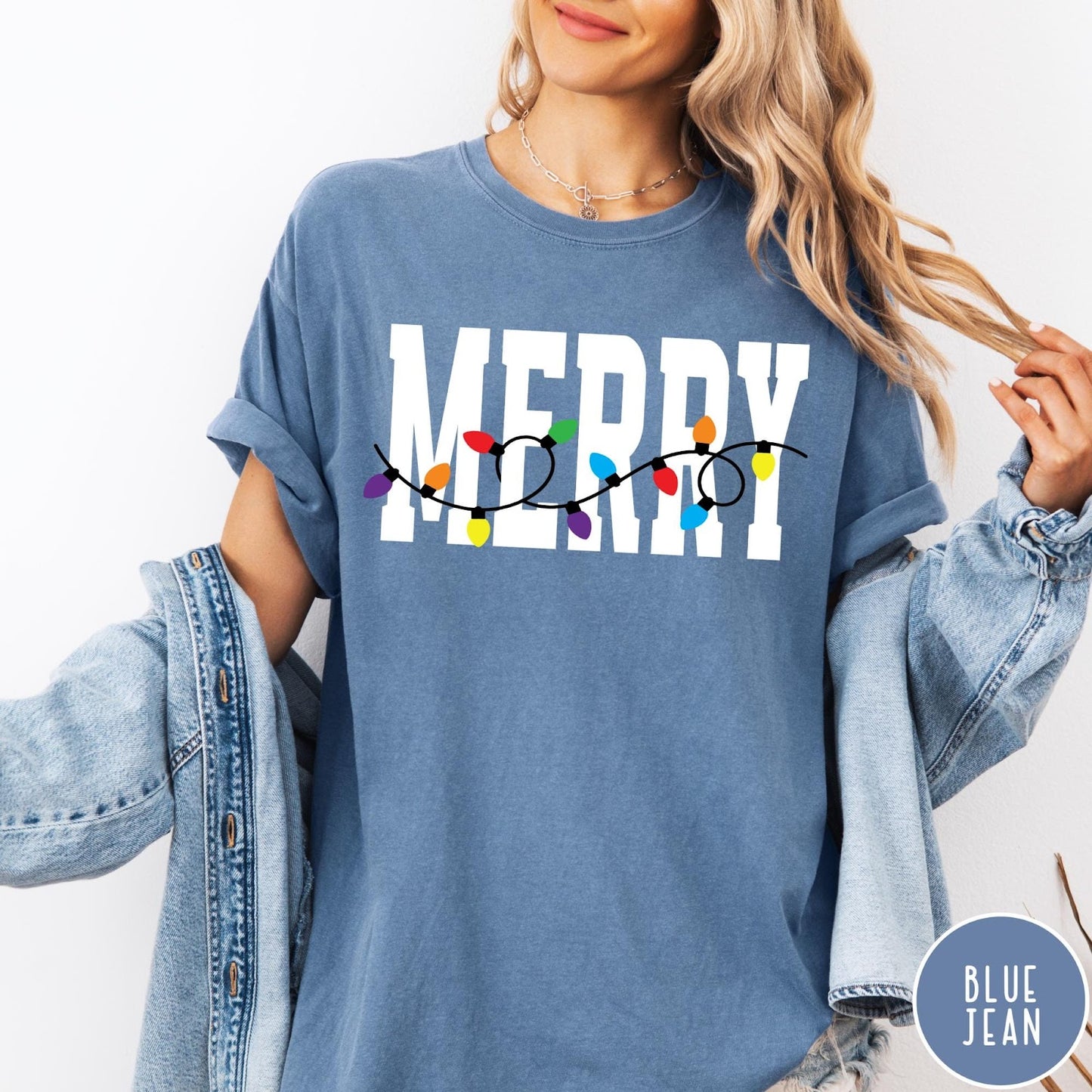 Comfort Colors tee in Blue Jean featuring festive holiday style graphic with Merry text and Christmas lights