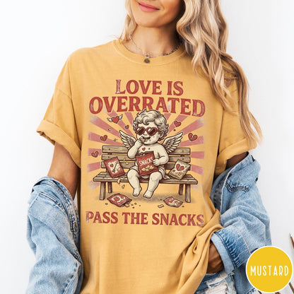 Comfort Colors tee in Mustard featuring vintage style graphic of a cherub eating snacks on a bench