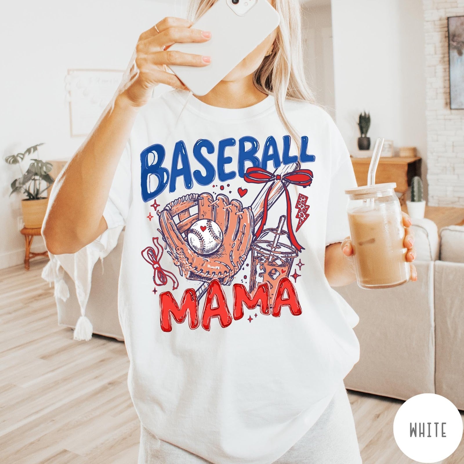 Comfort Colors tee in White featuring baseball design with glove, ball, iced coffee, and red bow graphic