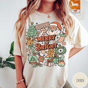 Comfort Colors tee in Ivory featuring retro holiday design with Santa, reindeer, and Christmas icons.