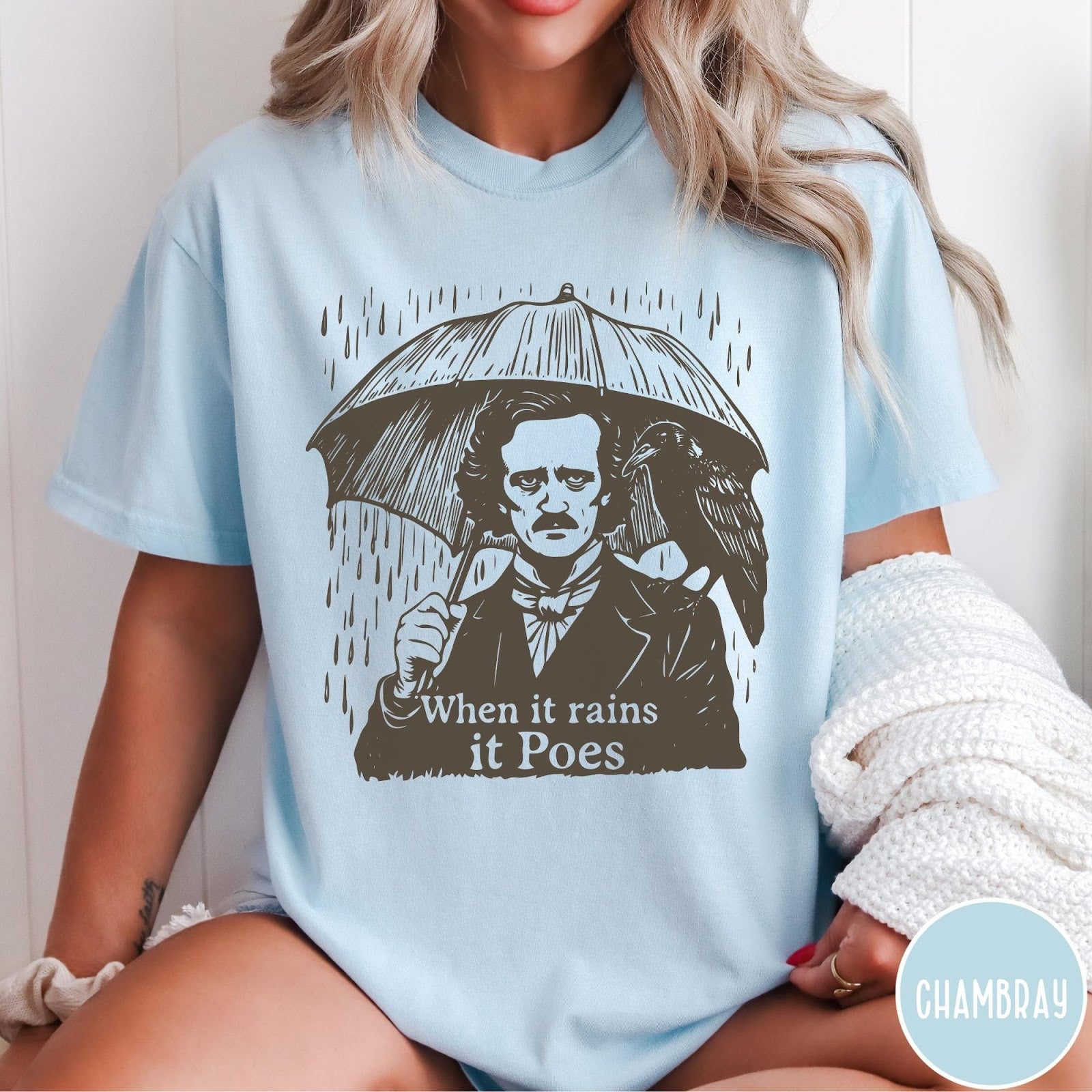 Comfort Colors tee in Chambray featuring graphic illustration of Edgar Allan Poe with umbrella and raven