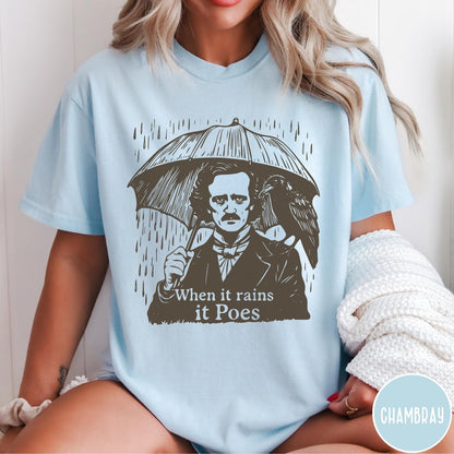Comfort Colors tee in Chambray featuring graphic illustration of Edgar Allan Poe with umbrella and raven