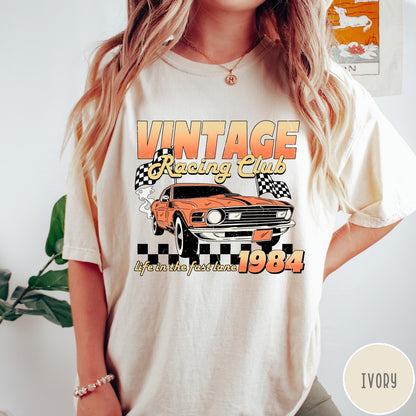 Comfort Colors tee in Ivory featuring vintage muscle car graphic with racing flags and 1984 text