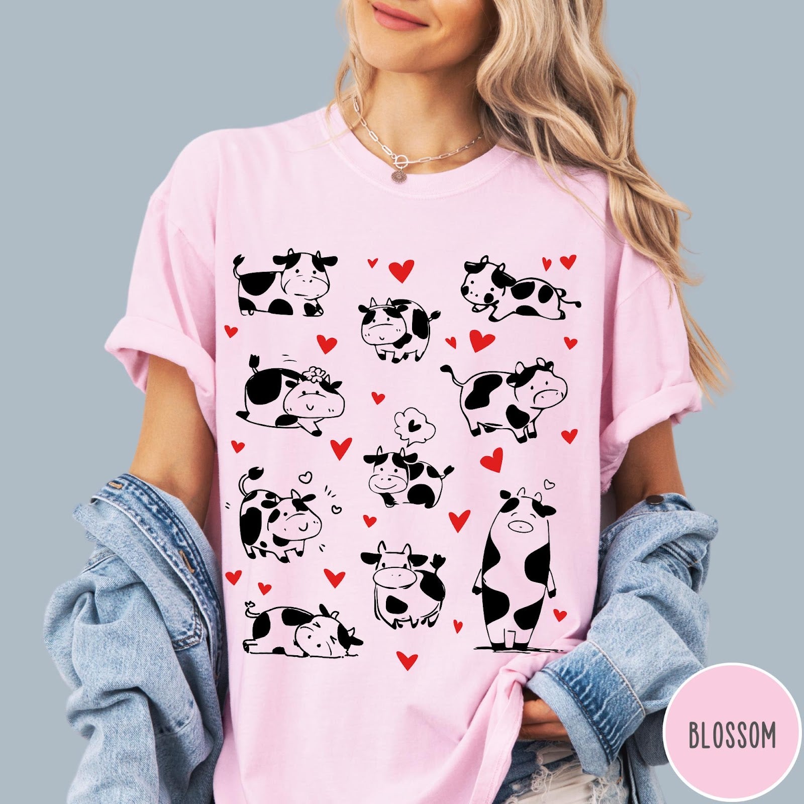 Comfort Colors tee in Blossom featuring cute cow lover graphic with various black and white cow illustrations