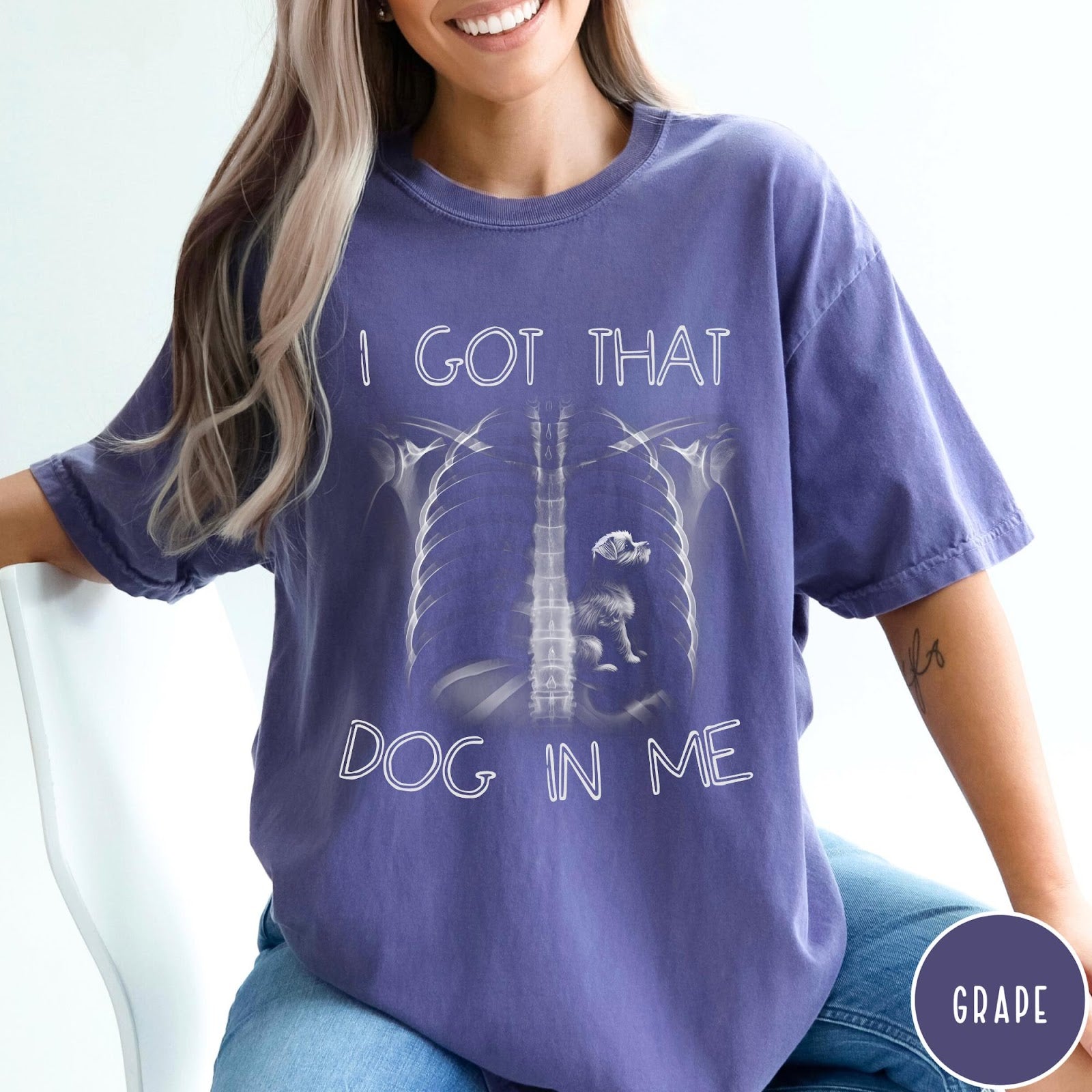 Comfort Colors tee in Grape featuring graphic style X-ray ribcage with a small dog sitting inside.