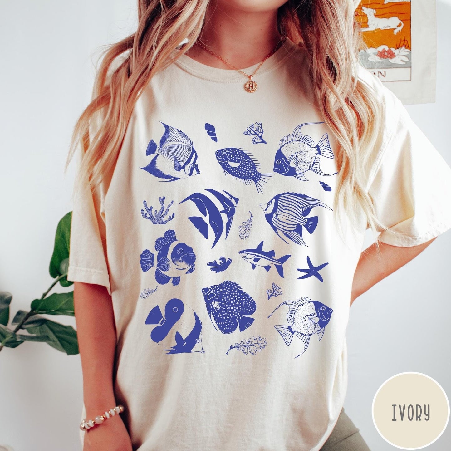 Comfort Colors tee in Ivory featuring coastal style graphic with various tropical fish and ocean life illustrations