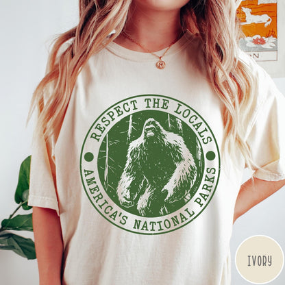 Comfort Colors tee in Ivory featuring circular graphic design with Bigfoot and Respect the Locals text