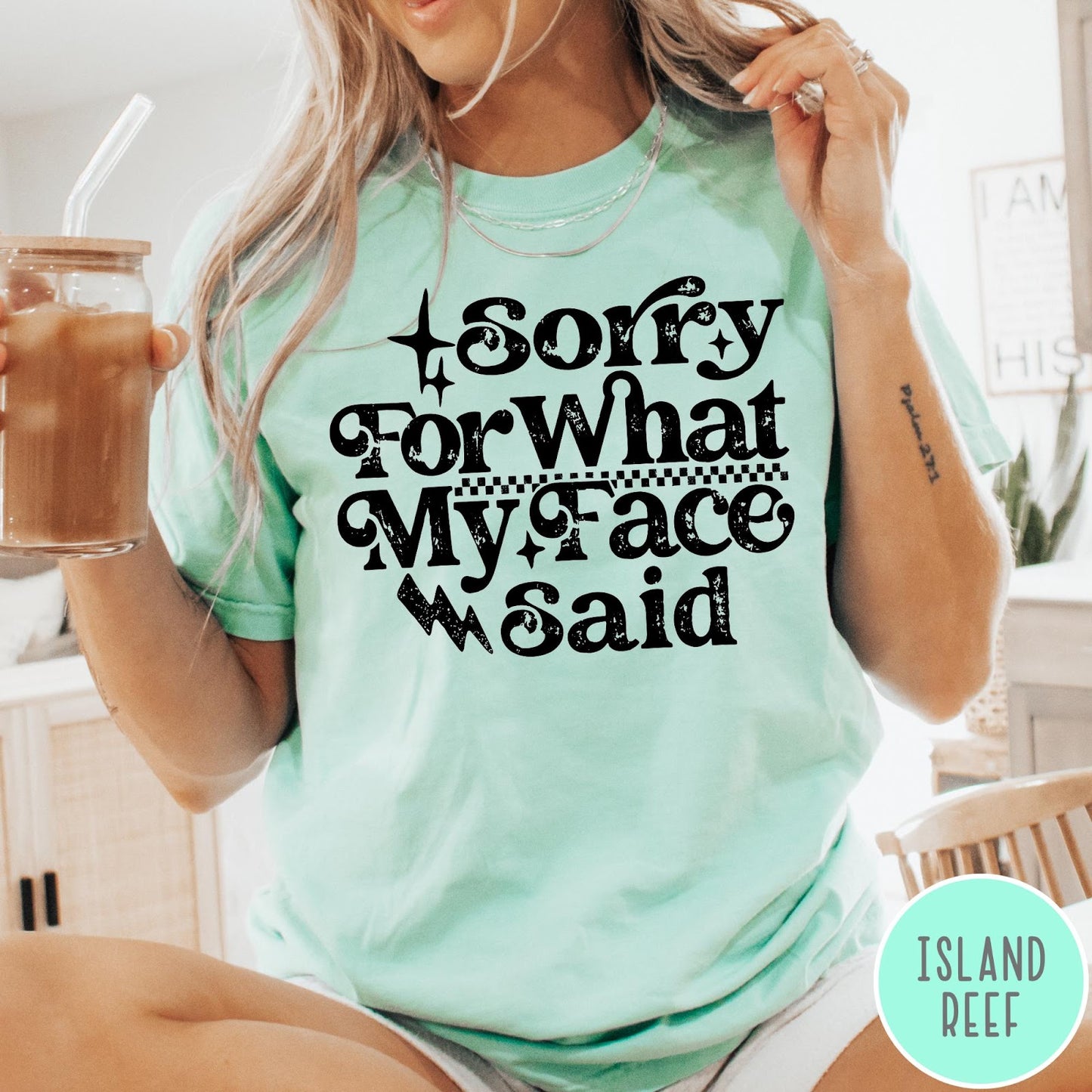 Comfort Colors tee in Island Reef featuring sarcastic expression graphic Sorry for What My Face Said in black