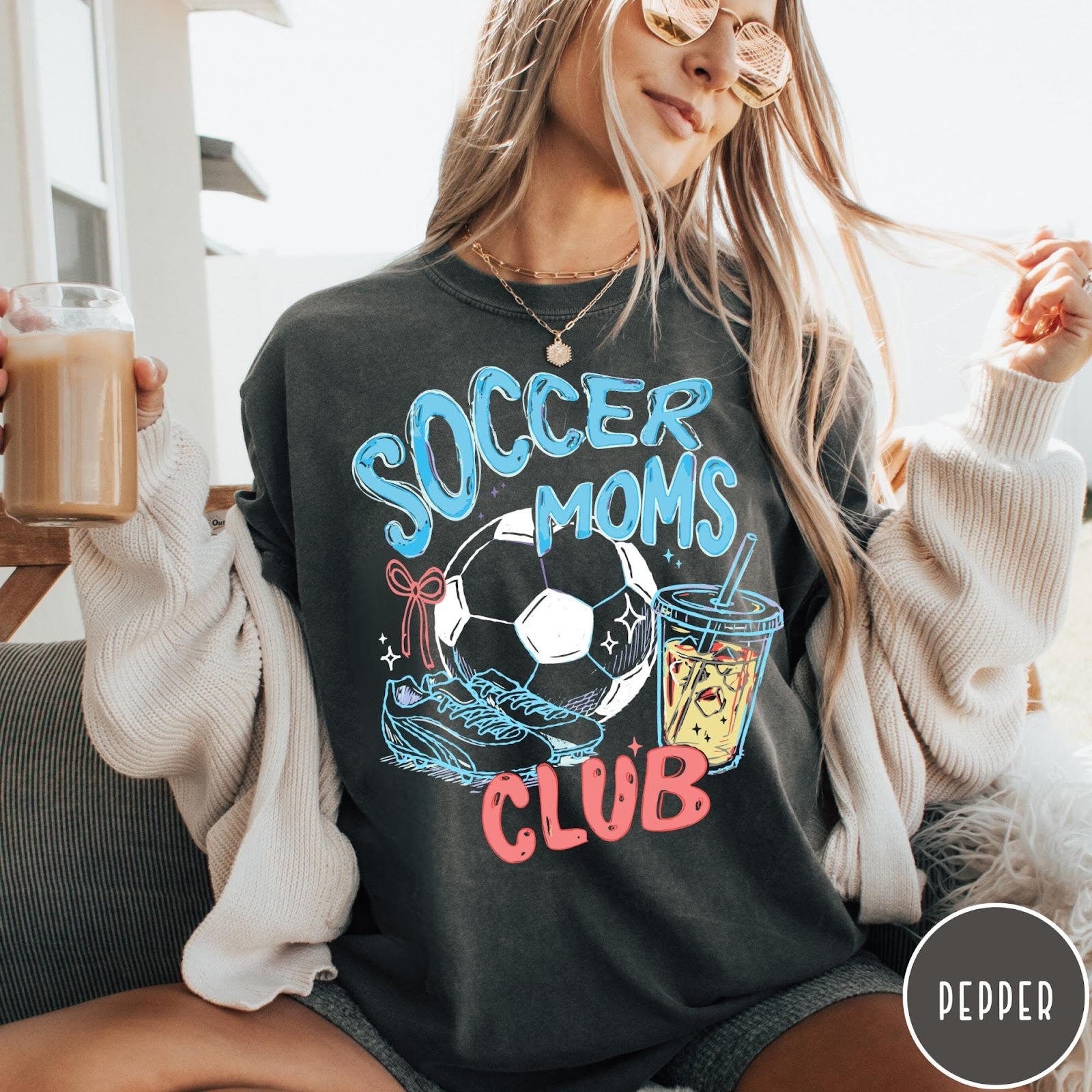 Comfort Colors tee in Pepper featuring soccer mom lifestyle graphic with soccer ball, cleats, and iced coffee