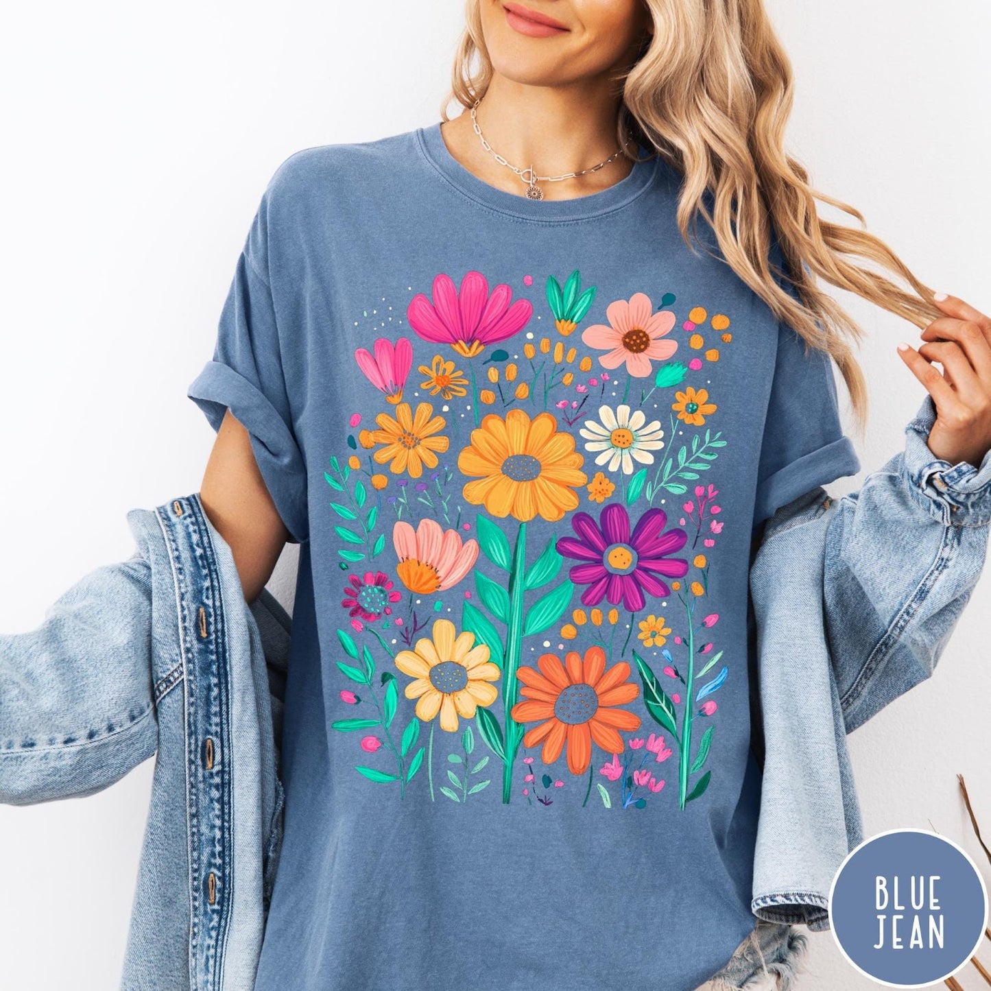 Comfort Colors tee in Blue Jean featuring boho style floral graphic with vibrant orange, pink, and purple flowers