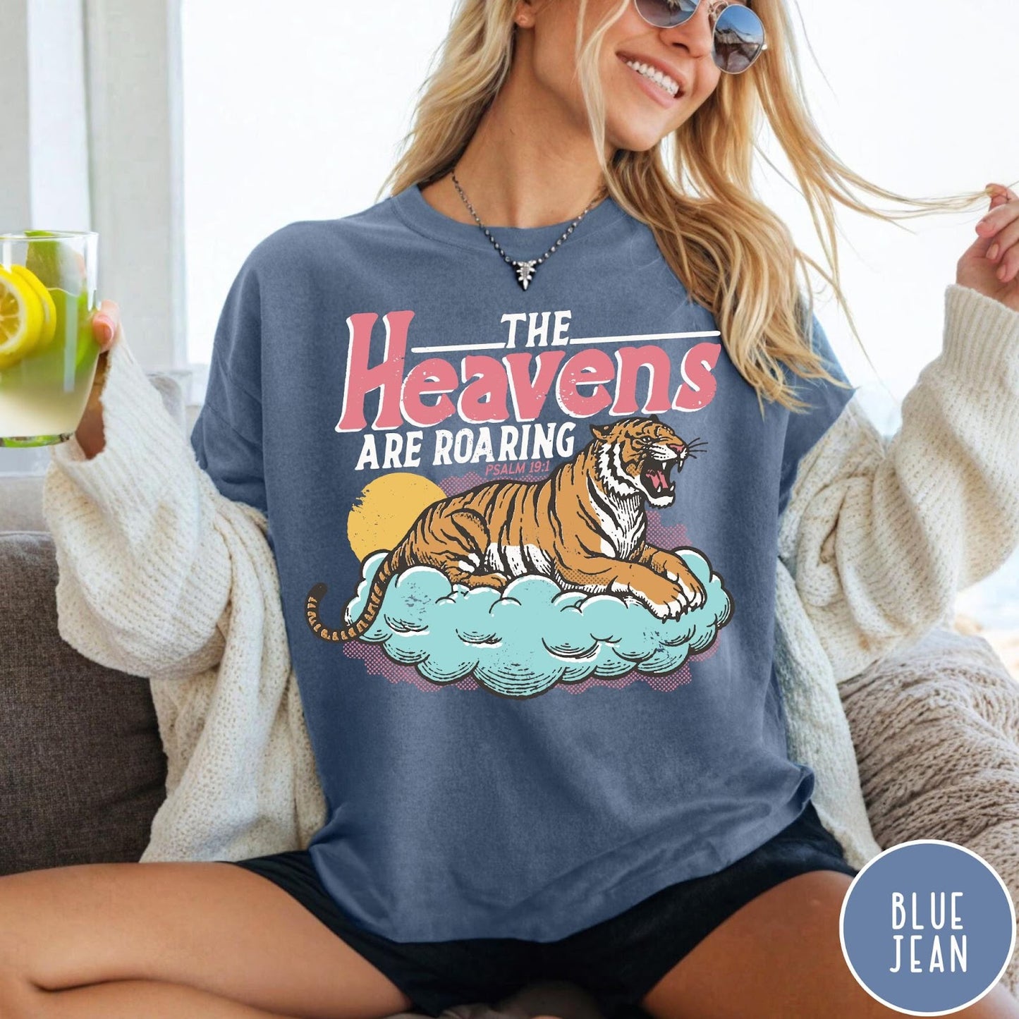 Comfort Colors tee in Blue Jean featuring retro graphic design of a roaring tiger resting on a cloud