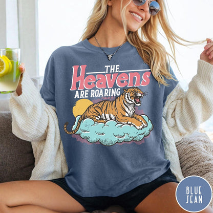 Comfort Colors tee in Blue Jean featuring retro graphic design of a roaring tiger resting on a cloud
