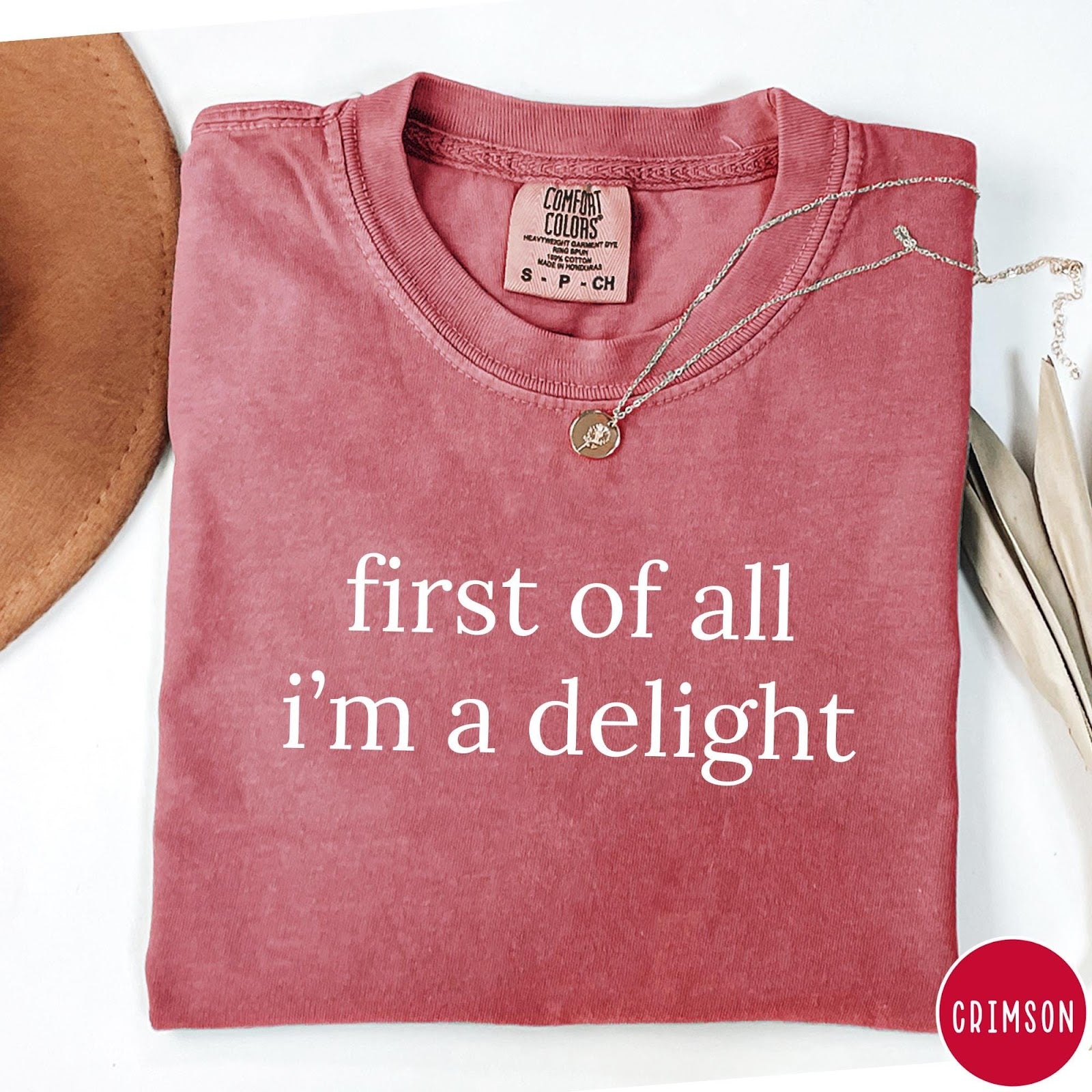Comfort Colors tee in Crimson featuring typography graphic reading first of all i'm a delight in white
