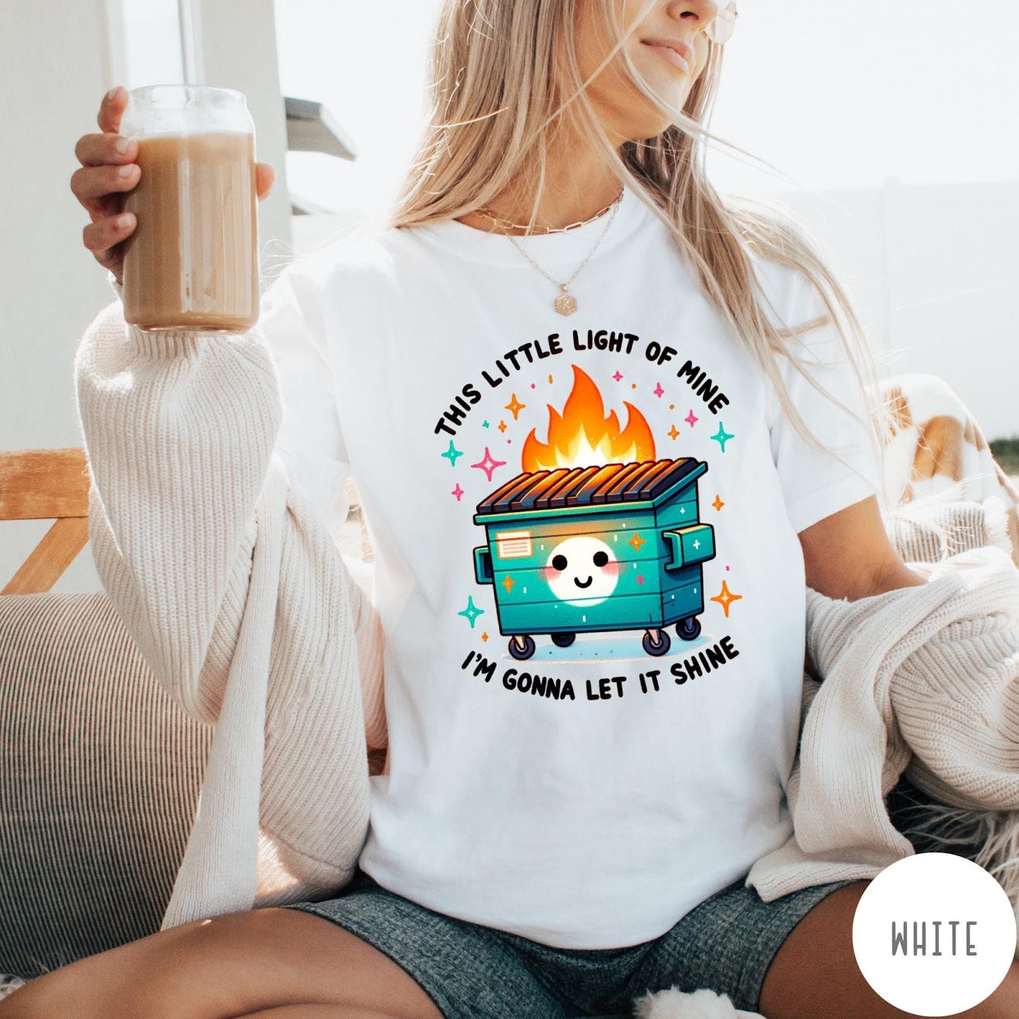 Comfort Colors tee in White featuring cartoon style graphic of a smiling dumpster fire with text