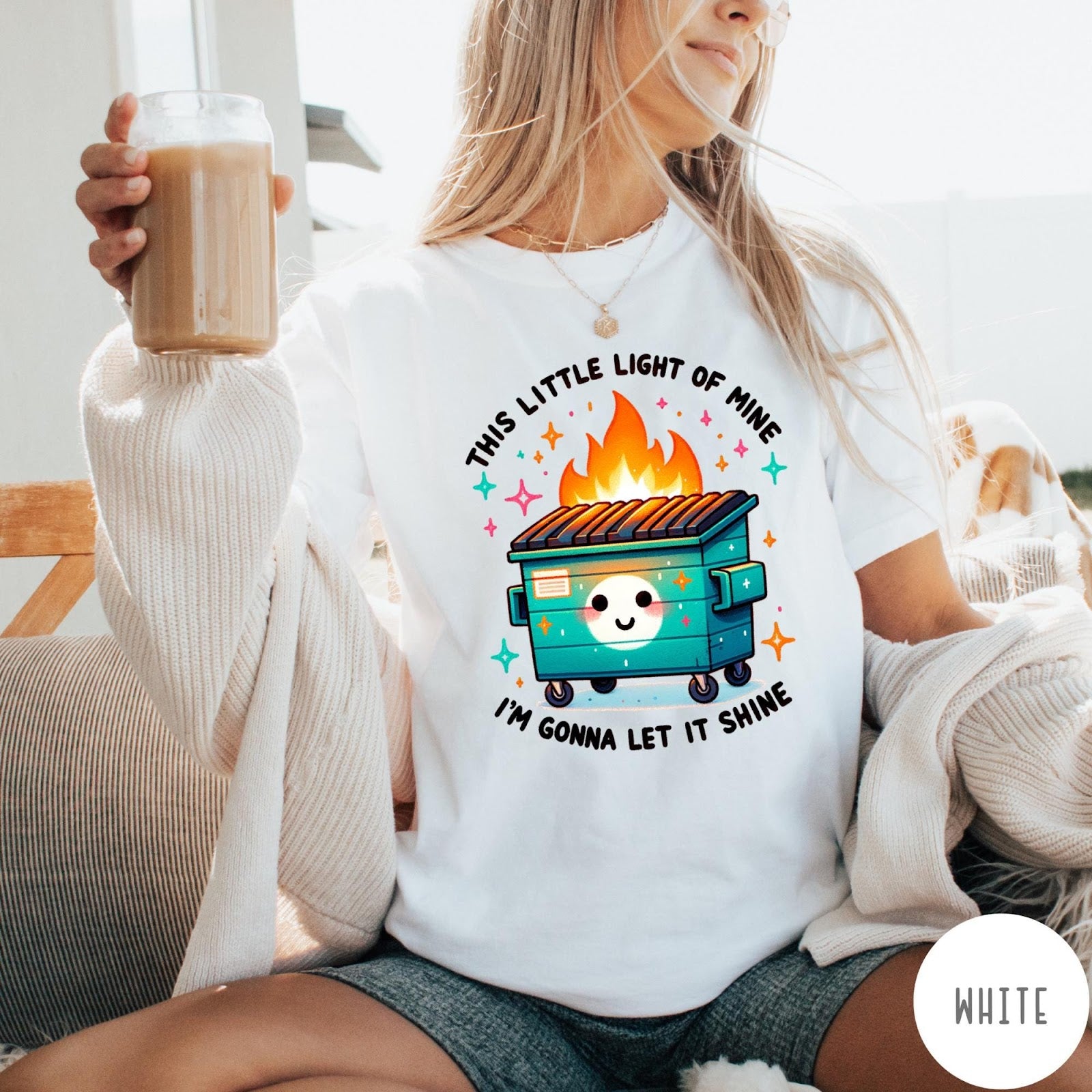 Comfort Colors tee in White featuring cartoon style graphic of a smiling dumpster fire with text