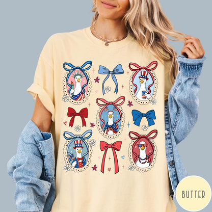 Comfort Colors tee in Butter featuring coquette design with patriotic geese in frames and bows