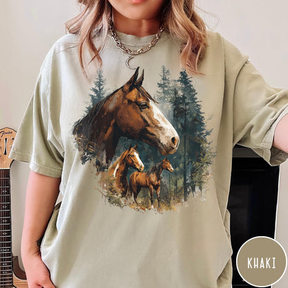 Comfort Colors tee in Khaki featuring vintage style graphic of three horses standing in a pine forest