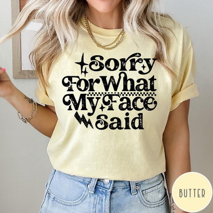 Comfort Colors tee in Butter featuring sarcastic expression graphic with Sorry For What My Face Said text