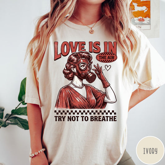 Comfort Colors tee in Ivory featuring retro style graphic of a woman wearing a gas mask