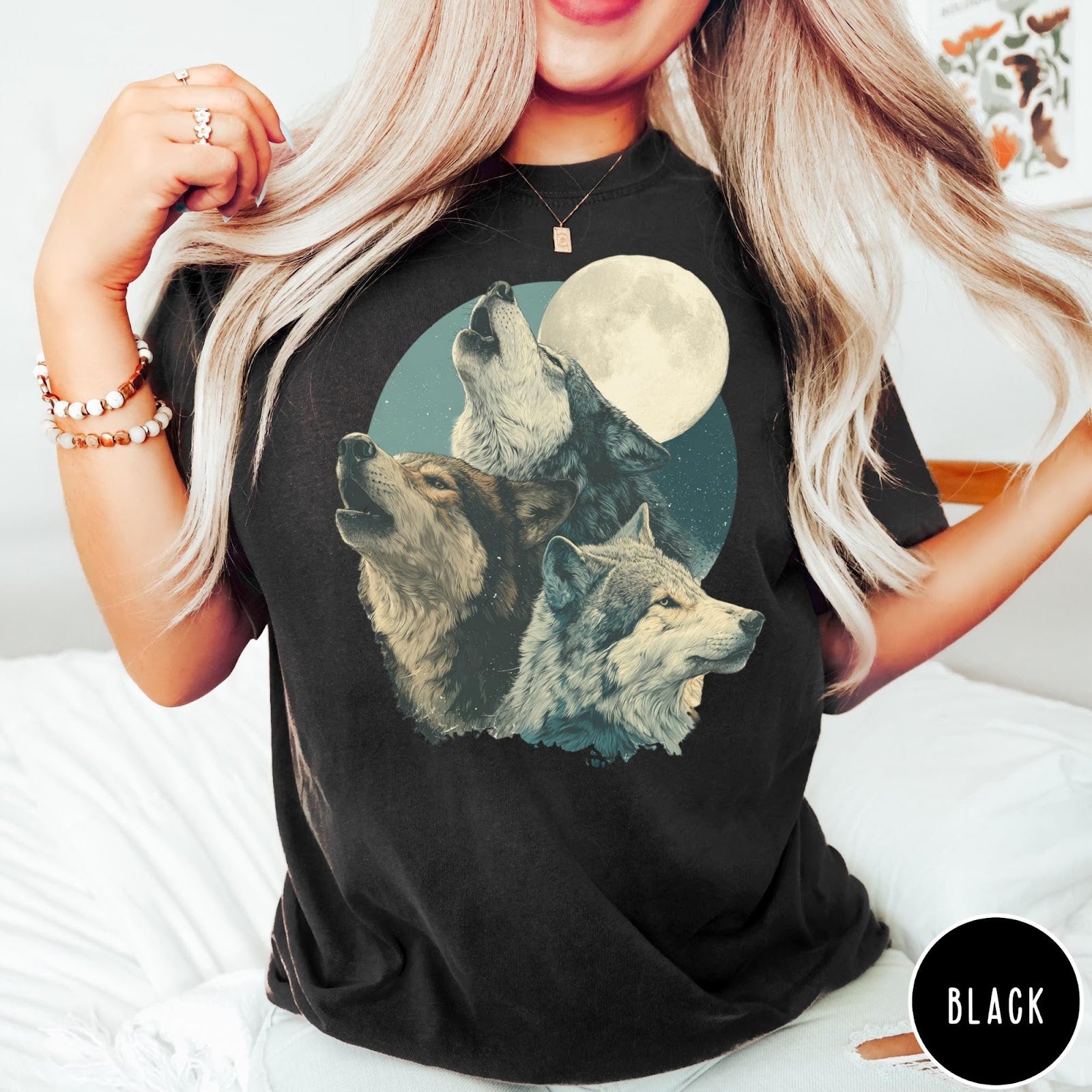 Comfort Colors tee in Black featuring vintage style graphic of three howling wolves under a full moon
