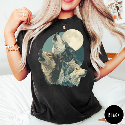 Comfort Colors tee in Black featuring vintage style graphic of three howling wolves under a full moon